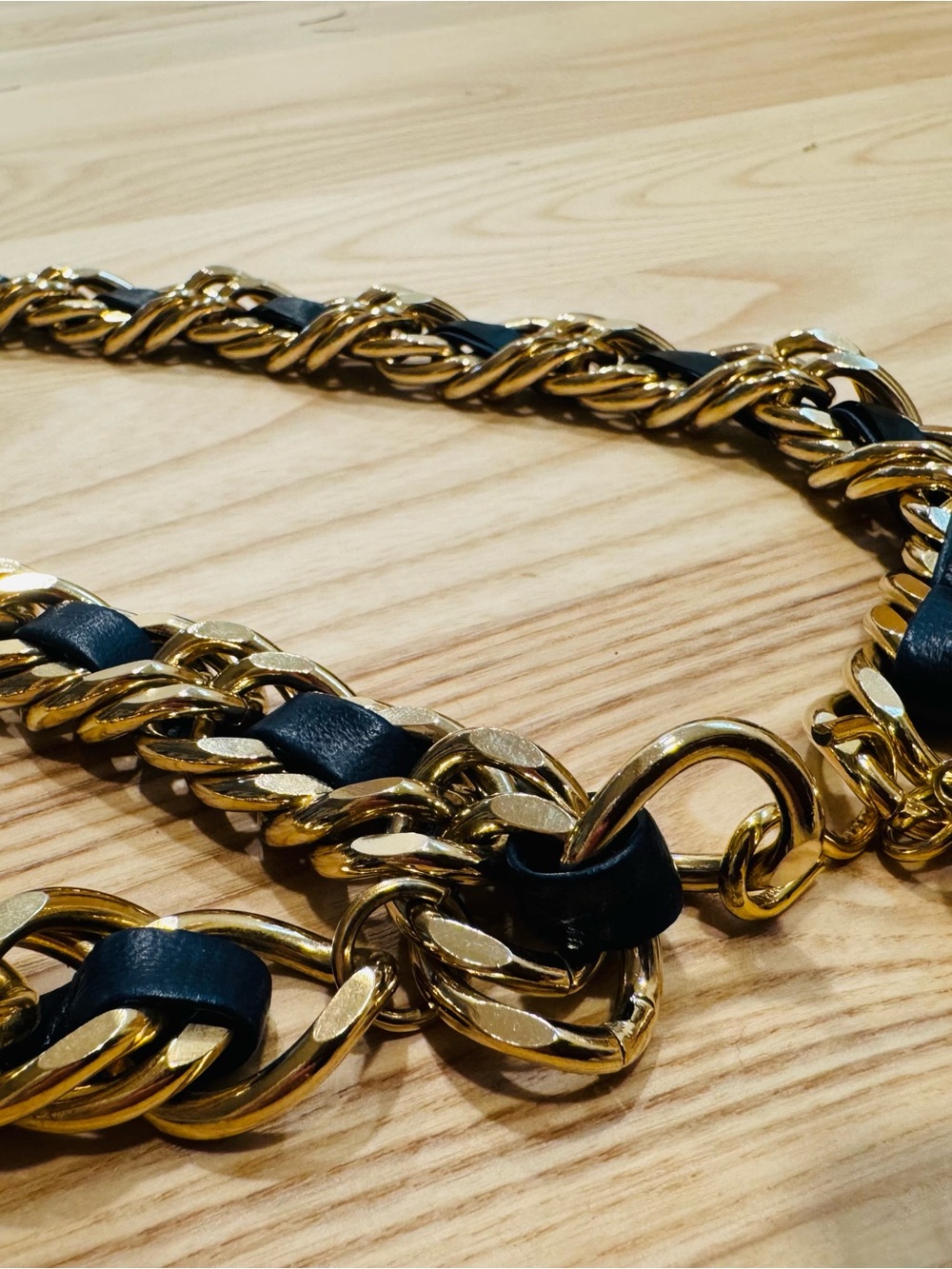 Possible Chanel gold chain and leather woven belt
